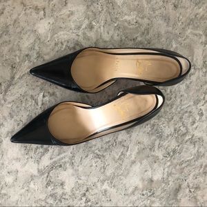 Christian Louboutin half d’Orsay leather pumps.